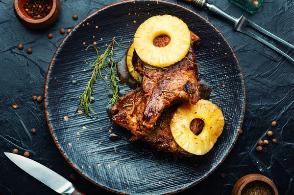 Grilled meat with pineapple. Grilled pork chop with pineapple
