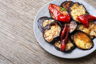 Roasted eggplants and grilled bell pepper on a plate