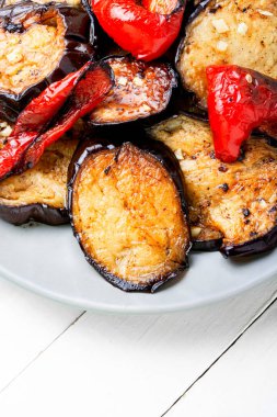 Roasted eggplants and grilled bell pepper on a plate