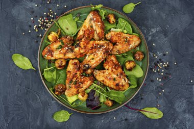 Baked chicken wings with sesame seeds. Chicken meat