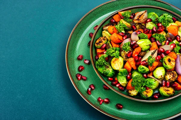 Salad Brussels Sprouts Carrots Decorated Greens Pomegranate Green Plate Space — Stok Foto