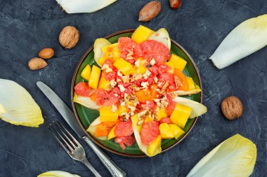 Delicious salad of grapefruit, mango and chicory. Healthy food