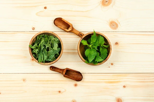 Fresh Dried Organic Nettles Mortar Wooden Table Top View — Stock Photo, Image