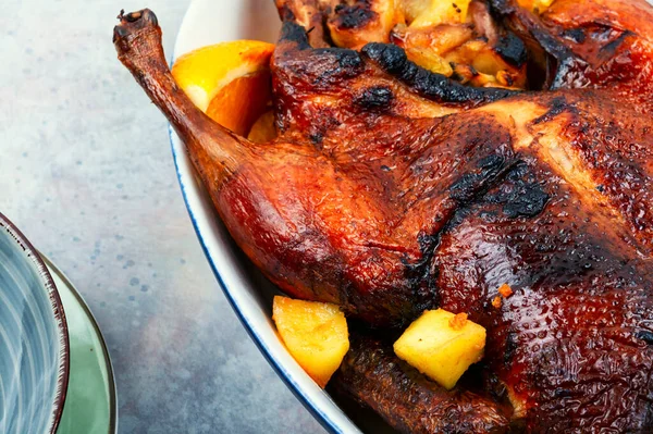 stock image Roast duck with orange and caramelized apples.