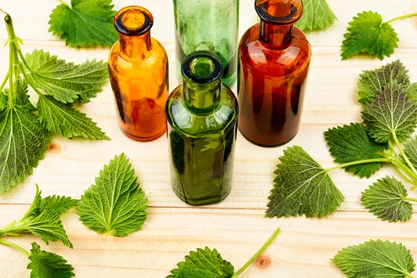 Fresh Nettle Leaves Pharmacy Bottle Homeopathic Herbs Herbal Medicine — Stock Photo, Image