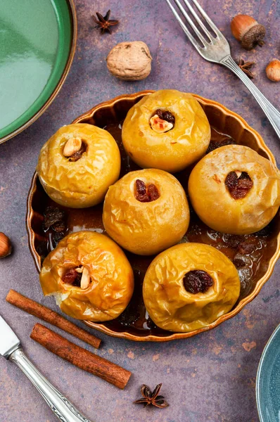 Baked autumn apples with nuts and raisins. Low-calorie dessert. Top view.