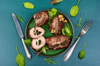 Beef rolls stuffed with mushrooms and herbs. Roasted meat, meatloaf