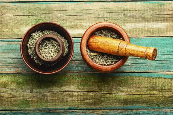 Herbal medicine, medicinal herbs. Wormwood in a mortar.