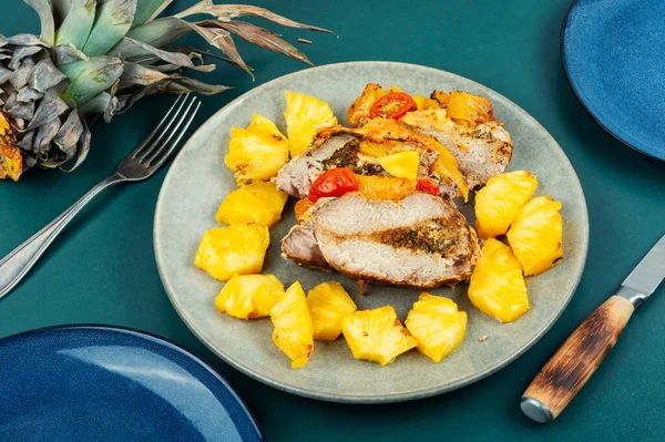 Appetizing meat roasted with fresh pineapple, colorful food.
