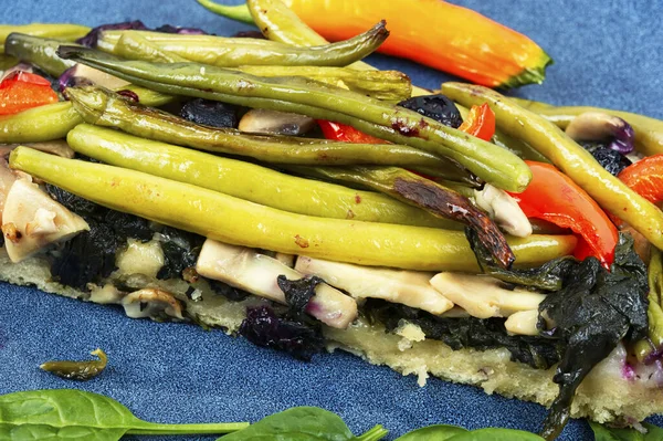 Vegetable pie with green or bush beans and bell peppers. Close up.