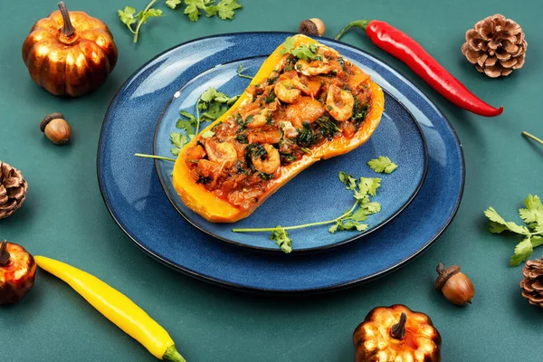 Half a butternut squash or pumpkin stuffed with vegetables and shrimp.