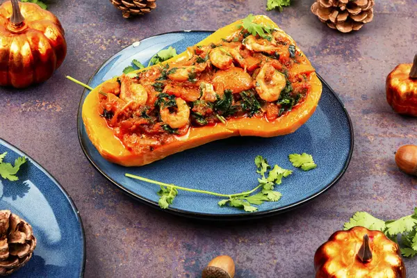 Autumn butternut squash stuffed with peppers, tomatoes and shrimp.