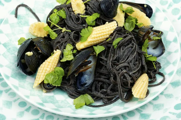 Typical Italian pasta with boiled mussels. Mediterranean pasta vongole.