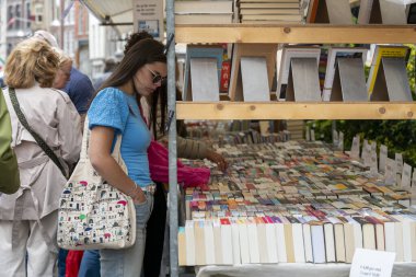 Dordrecht, Netherlands - July 7, 2024: Visitors explore second-hand books at the annual book market in Dordrecht, 350 stalls throughout the city centre, where booksellers offer their best books. clipart