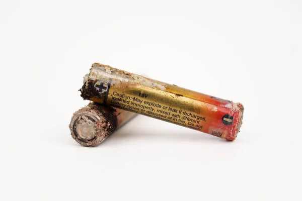 stock image Damaged and corroded batteries isolated on white background.