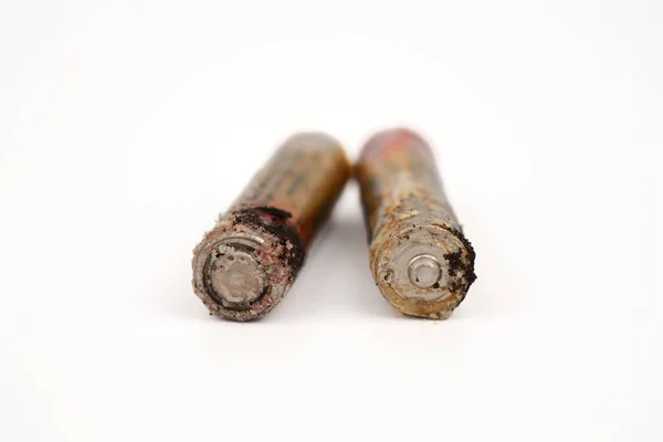 stock image Damaged and corroded batteries isolated on white background.