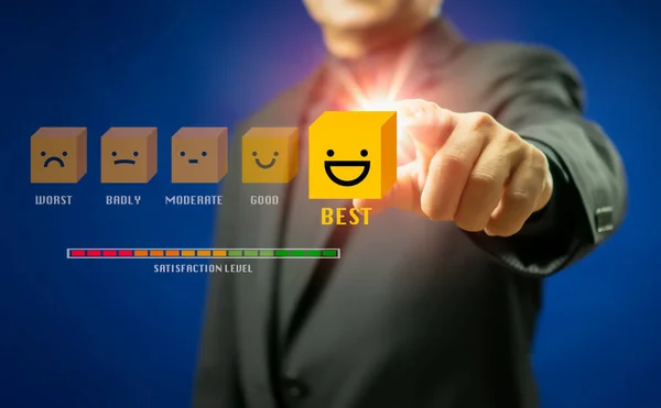Businessman or customer give rating to service experience on virtual touch screen and finger pressing smiley face emoticon to review satisfaction feedback survey, Customer service evaluation concept