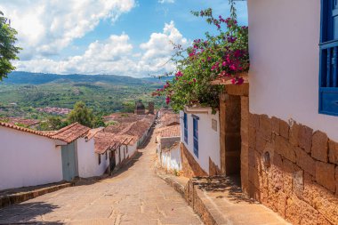 Colorful streets of Barichara, Santander, Colombia. Its cobblestone streets and colonial houses make this town a paradise to enjoy and explore its history. clipart