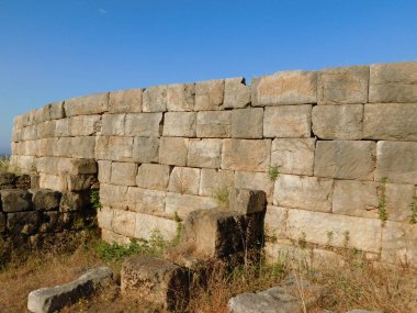 An ancient stone wall in the city of Messene in the Peloponnese, Greece