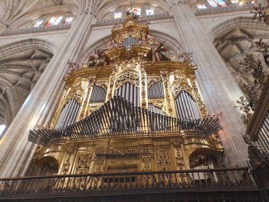 A beautiful golden pipe organ in the city of Segovia cathedral