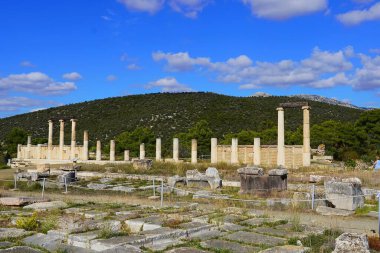 Ruins of the colonnade over the underground Avaton, where patients were healed by the god Asclepius in the Epidavros archaeological site clipart