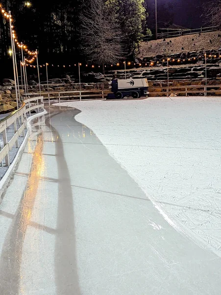 stock image Beautiful outdoor ice rink at night with lights