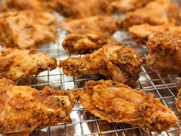 stock image Chicken wings in a marinade on a baking sheet. Cooking chicken with spices in the oven.