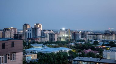 scenic views of bishkek city skyline and mountains in kyrgyzstan clipart