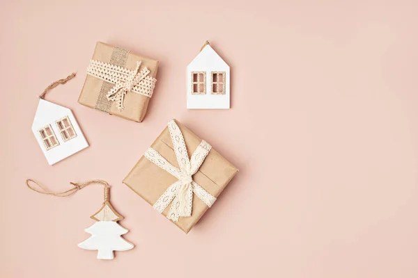 Assortment of Scandinavian style, eco friendly, handmade Christmas decoration and gifts on pink background, sustainable xmas idea. Flat lay, top view