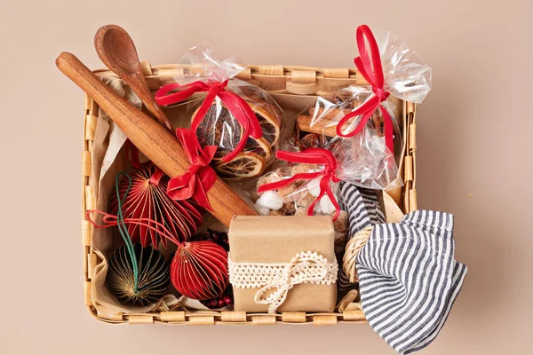 Refined Christmas gift box for culinary enthusiats with spices and kitchen utensils. Corporate or personal present for cooking lovers, foodies and gourmands.