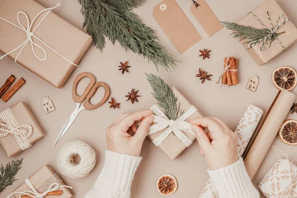 stock image Christmas background with gift boxes and rolls of colored kraft wrapping paper. Xmas celebration, preparation for winter holidays. Festive mockup, top view, flatlay