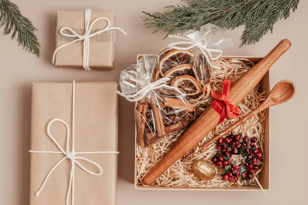 Refined Christmas gift box for culinary enthusiats with spices and kitchen utensils. Corporate or personal present for cooking lovers, foodies and gourmands.
