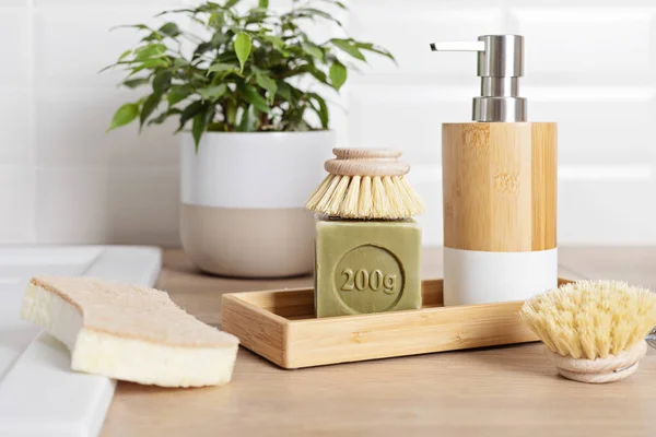Home cleaning non toxic, natural products. Washing dishen in kitchen with olive oil soap and brushes. Plastic free, zero waste, sustainable lifestyle idea