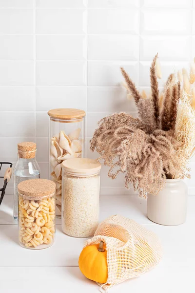 Assortment Grains Cereals Pasta Glass Jars Kitchen Utensils Wooden Table — Stock Photo, Image