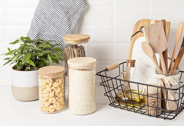 Assortment Grains Cereals Pasta Glass Jars Kitchen Utensils Wooden Table — Stock Photo, Image