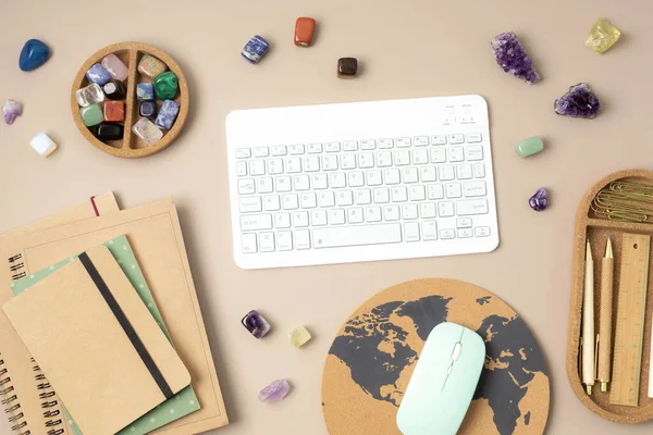 Healing chakra crystals and computer keyboard. Online application for rituals with gemstones for career, wellness, business, relaxation, mental health, spiritual practices. Energetical power concept