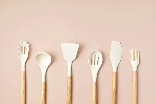 Pastel color kitchen utensils top view. Cooking blog, classes, workshop, recipe template concept