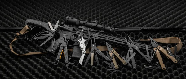 Various Multi Tools Lie Automatic Carbine Gray Foam Surface Dark — Stock Photo, Image