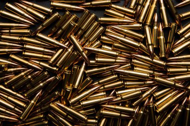Background from cartridges for a carbine. Ammunition for modern weapons.