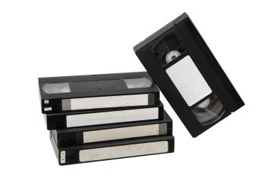 Pile of VHS video cassettes. Vintage media. Isolate on a white background.