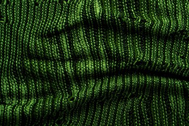 Yeşil örülmüş kumaş dokusu, detaylı desen ve canlı renk, arka plan, tekstil sanatı ve samimi malzeme çizimleri için uygun..