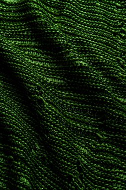Yeşil örülmüş kumaş dokusu, detaylı desen ve canlı renk, arka plan, tekstil sanatı ve samimi malzeme çizimleri için uygun..