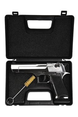 A sleek silver handgun with a black grip is displayed in a black foam-lined case, accompanied by a cleaning brush, showcasing a professional and secure storage solution for firearms. clipart