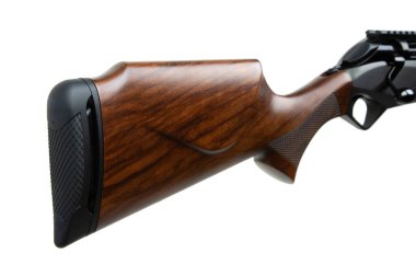 A close-up view of a polished wooden rifle stock with a black rubber butt pad, showcasing the wood grain texture and craftsmanship, perfect for hunting and outdoor equipment themes.