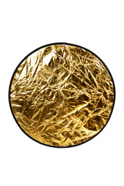 Altın fotoğrafçı yansıtıcısının parlak, buruşuk yüzeyine yakın çekim.