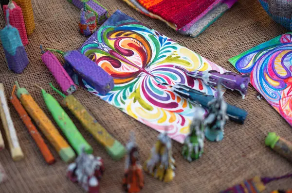 stock image Vibrant art supplies and colorful patterns displayed on rustic fabric during a creative workshop at an art fair