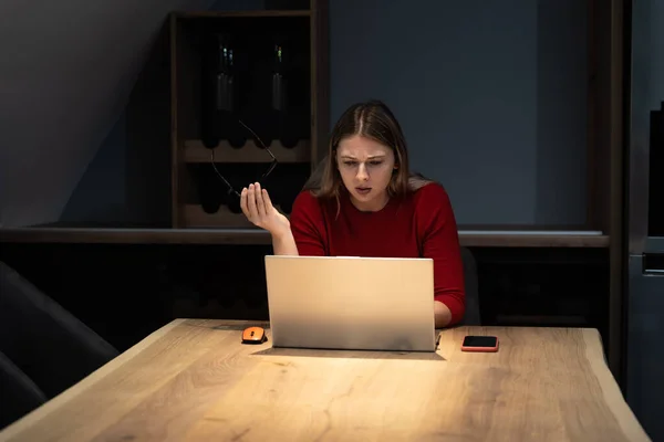 Frustrated annoyed woman confused by computer problem, annoyed businesswoman feels indignant about laptop crash, bad news online or disgusting video on web, stressed student looking at broken comp