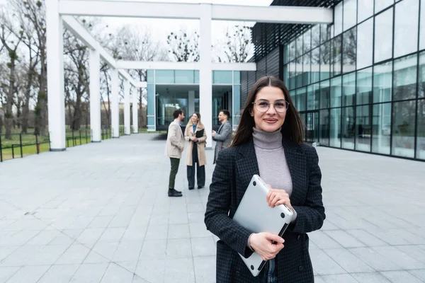 Woman business person CEO, leader and strong independent worker portrait outside office building. Female leadership in company, educated expert staff member. Strongest link in chain concept
