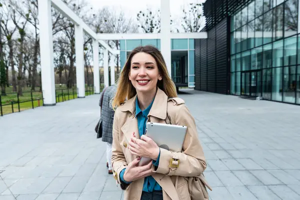 Woman business person CEO, leader and strong independent worker portrait outside office building. Female leadership in company, educated expert staff member. Strongest link in chain concept
