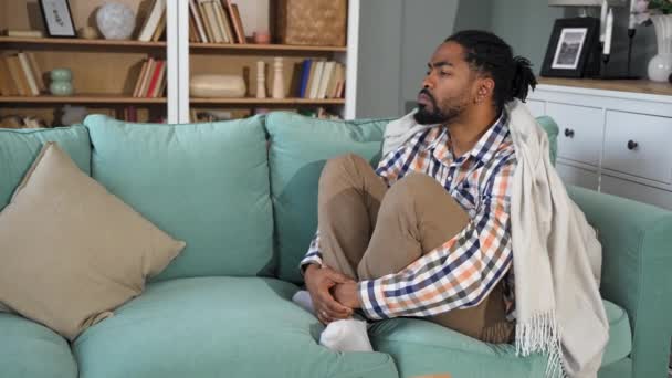 Young Depressed African American Man Sitting Sofa Crossed Arms Racism — Vídeo de Stock